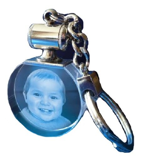 Porte clés rond lumineux bleu.